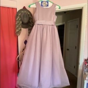 Girls size 7 flower girl dress in lavender purple. From David’s bridal
